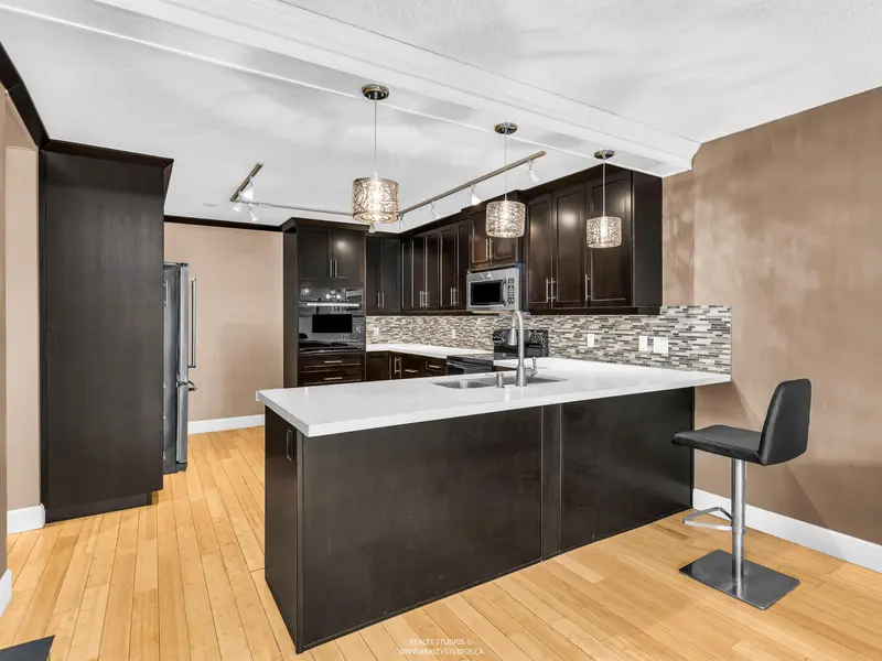 203 4323 GALLANT AVENUE - photo 3 of 25